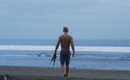 Walking on beach with fins. Photo by Hannah Walsh.
